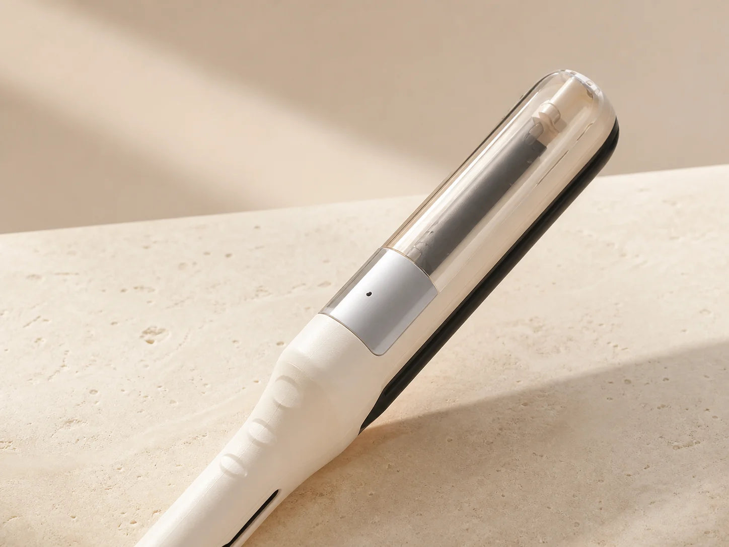 Close detail of the translucent guide chamber on the beige Ends Well tool